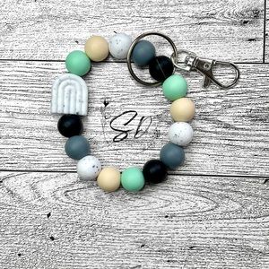 Small Silicone Wristlet With White Speckled Rainbow